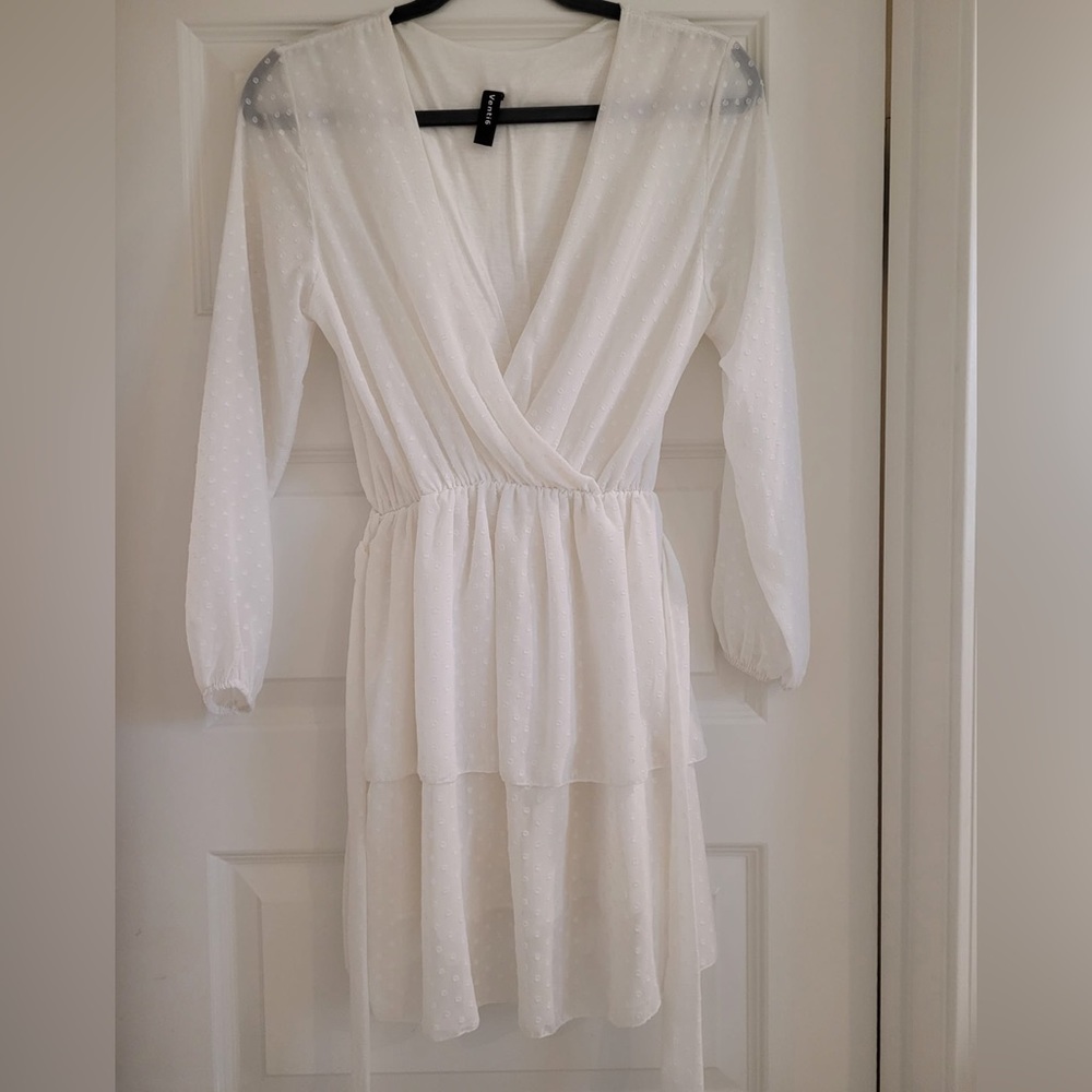 White polka dot ruffle mini, long sleeve summer dress with a belt. Fits XS & S.